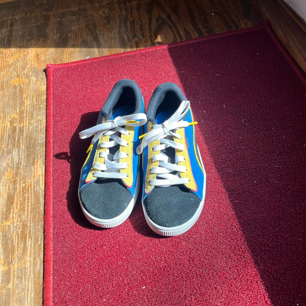 Gently used multi color Puma GM shoes for boys